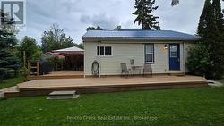 Side with awning up. - 