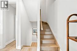 hardwood staircase to upper level - 