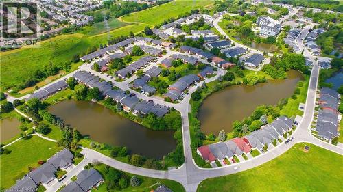 Residential development featuring a network of streets, surrounded by lush green spaces and multiple water features - 29 Archdeacon Clark Trail, Hamilton, ON 