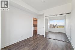 Spacious primary bedroom with double mirrored closets - 
