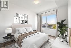 Virtually Staged Bedroom featuring a large window and neutral paint - 
