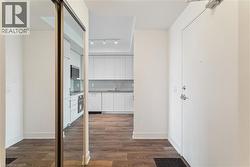 Welcome to unit 15. Front closet, Den to the left and kitchen and living area ahead - 