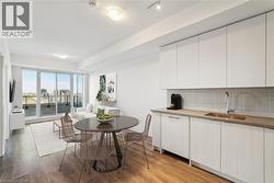 Virtually staged Integrated kitchen and dining living area Virtually staged - 