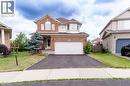 Two-story residence featuring a brick facade with light-colored siding accents, an integrated single-car garage, and a bay window on the upper level - 566 Avignon Place, Waterloo, ON 