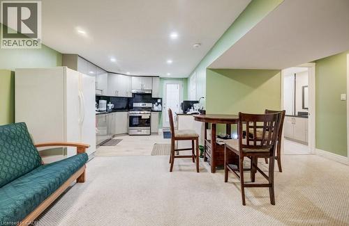 Kitchenette featuring gray cabinetry, black countertops, and stainless steel appliances - 123 Forest Edge Trail, Kitchener, ON - Indoor