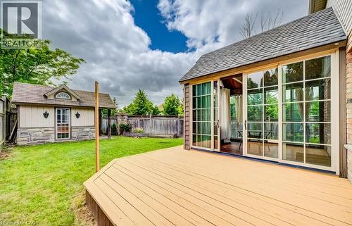 Expansive outdoor deck with a sunroom featuring multiple sliding glass doors - 123 Forest Edge Trail, Kitchener, ON - Outdoor With Deck Patio Veranda With Exterior