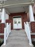 Brick facade featuring a covered porch entry - 235 Apple Hill Crescent, Kitchener, ON 
