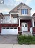 Two-story residence featuring a brick first level and light-colored siding on upper levels - 235 Apple Hill Crescent, Kitchener, ON 