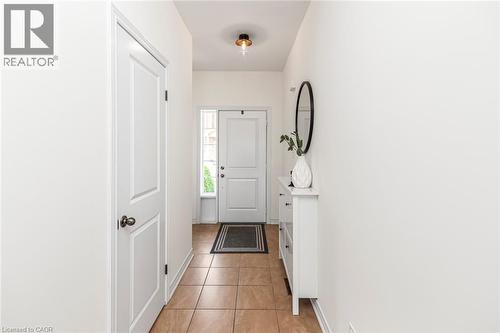 Welcoming front foyer with hall closet and access to the garage - 45 Seabreeze Crescent Unit# 22, Stoney Creek, ON 