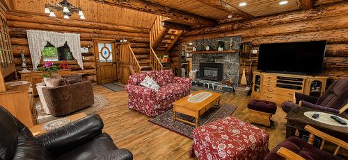 8793 Colony Road, Wardner, BC - Indoor Photo Showing Living Room With Fireplace