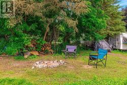 Northern part of rear yard has firepit - 