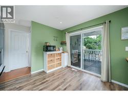 Convenient sliding glass doors to the covered patio and your private backyard oasis!! - 