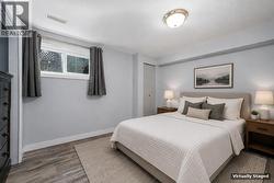 Fourth bedroom downstairs **This photo has been virtually staged** - 