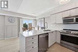 S/S appliance with granite counters and waterfall - 