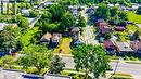 Expansive residential lot featuring a cleared building envelope, bordering mature trees, and street frontage - 153 Courtland Avenue E, Kitchener, ON 