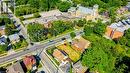 Aerial perspective showcasing a residential area with street intersections and abundant mature trees - 153 Courtland Avenue E, Kitchener, ON 