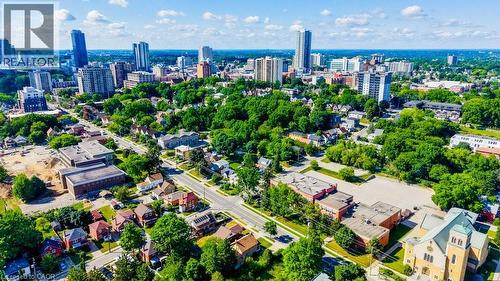 Expansive urban landscape featuring a mix of residential structures and commercial buildings - 153 Courtland Avenue E, Kitchener, ON 