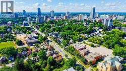 Aerial perspective showcasing a vibrant urban landscape with a mix of residential structures and commercial buildings - 