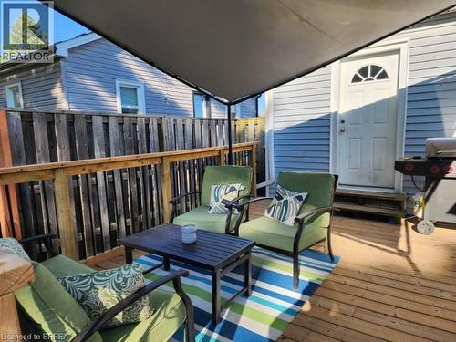 Spacious wood-finish deck with a privacy fence - 86 North Park Street, Brantford, ON 