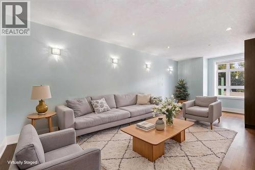 virtually staged main floor family room - 1513 23 Avenue Sw, Calgary, AB 