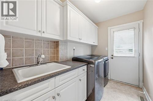 Main floor laundry room with direct access from rear yard - 1 Idared Road, Carlisle, ON - Indoor Photo Showing Laundry Room