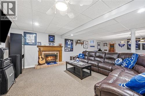 Massive lower level with plenty of space for entertaining and relaxation - 1 Idared Road, Carlisle, ON - Indoor With Fireplace