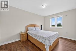 Room featuring wood-finish flooring and neutral wall tones - 