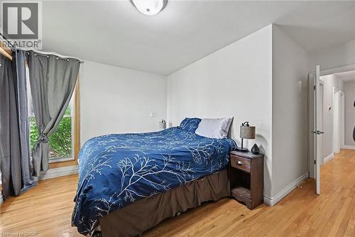 Hardwood flooring, white walls, and a window with wood trim - 56 Everton Place, Hamilton, ON 