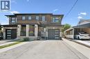 Contemporary facade featuring brick and wood-look siding accents - 63 Plymouth Road, Kitchener, ON 