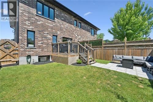 Exterior rear elevation with brick cladding and black-framed windows - 63 Plymouth Road, Kitchener, ON 
