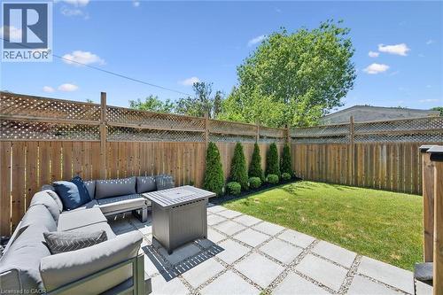 Private backyard with a combination wood and lattice fence - 63 Plymouth Road, Kitchener, ON 