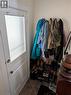 Entryway with tile flooring, a white paneled door featuring a frosted glass insert, and neutral wall tones - 15 Martin Street, Kitchener, ON 