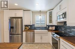 NEWER KITCHEN WITH STAINLESS STEEL APPLIANCES - 