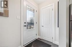 Doorway featuring baseboards - 