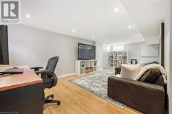 Office space with light wood-style flooring and recessed lighting - 