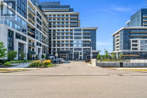 622 - 3200 William Coltson Avenue, Oakville, ON - Outdoor With Balcony With Facade