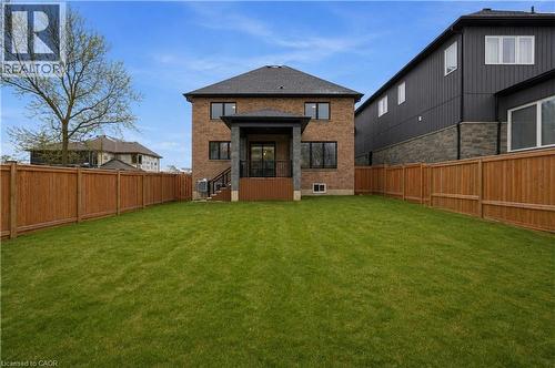 Expansive green lawn framed by a new wood fence - 7 Bartlett Avenue, Grimsby, ON 