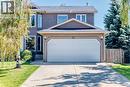 Freshly painted stucco exterior - 21 Shawbrooke Bay Sw, Calgary, AB 