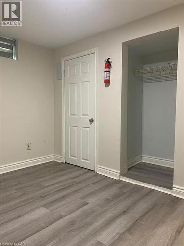 Room featuring wide-plank wood-finish flooring and neutral-toned walls - 58 Farrier Drive Unit# Basement, Kitchener, ON - Indoor Photo Showing Other Room