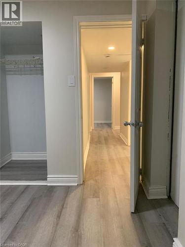 Entryway featuring wood-finish flooring, white baseboards, recessed lighting, and a closet with wire shelving - 58 Farrier Drive Unit# Basement, Kitchener, ON - Indoor Photo Showing Other Room