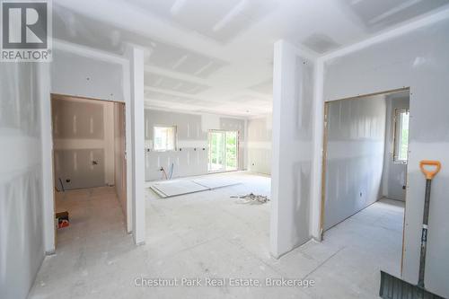 Upstairs view of laundry room, kitchen and bedroom - 23 Maple Ridge Road, Nipissing, ON - Indoor Photo Showing Other Room