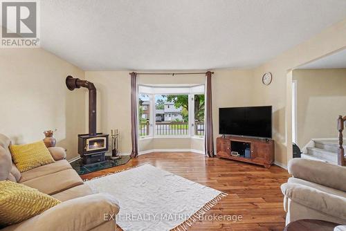 30 Bartley Crescent, Ottawa, ON - Indoor Photo Showing Living Room With Fireplace