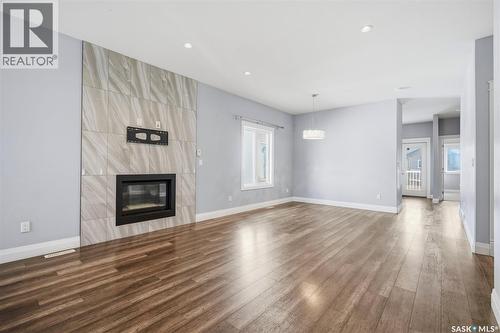 219 Ells Crescent, Saskatoon, SK - Indoor Photo Showing Living Room With Fireplace