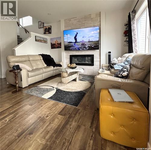 254 Aniskotaw Manor, Saskatoon, SK - Indoor Photo Showing Living Room With Fireplace