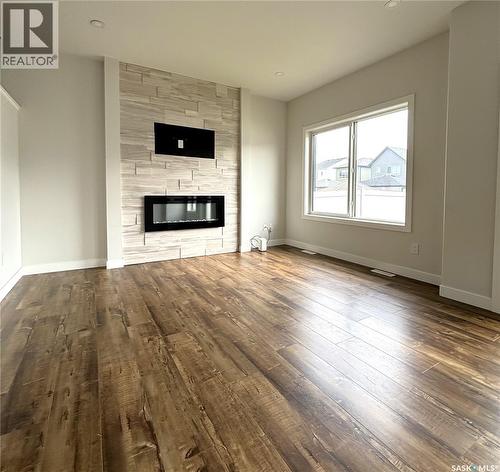 254 Aniskotaw Manor, Saskatoon, SK - Indoor Photo Showing Living Room With Fireplace