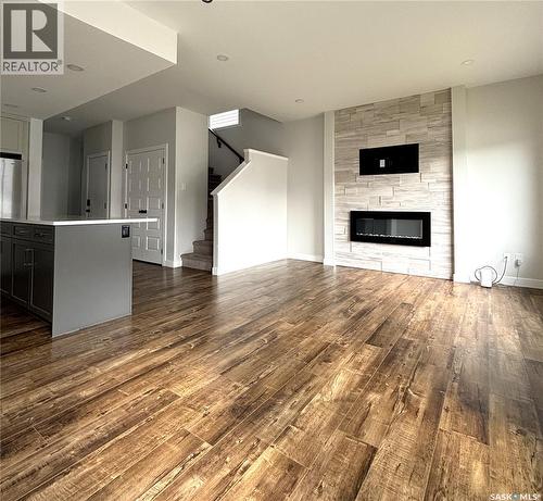 254 Aniskotaw Manor, Saskatoon, SK - Indoor Photo Showing Living Room With Fireplace