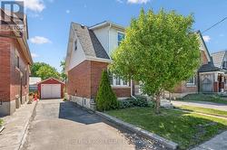 Private driveway to left of home, detached garage - 