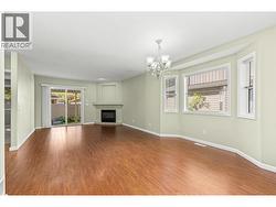 Living Room. Being an end unit there are lots of windows and brightness. - 