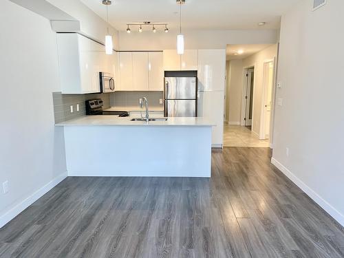 9907 91 Avenue, Edmonton, AB - Indoor Photo Showing Kitchen With Double Sink