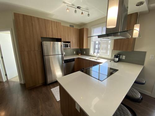 9907 91 Avenue, Edmonton, AB - Indoor Photo Showing Kitchen With Stainless Steel Kitchen With Double Sink